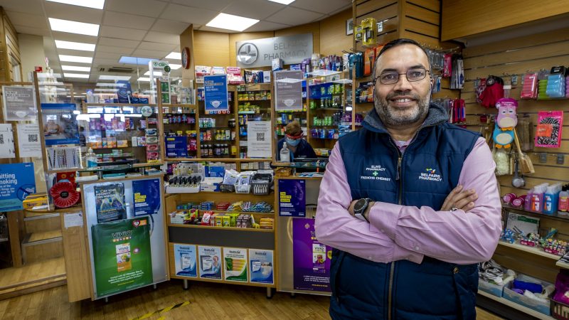 Pharmacist standing in front of the pharmacy counter