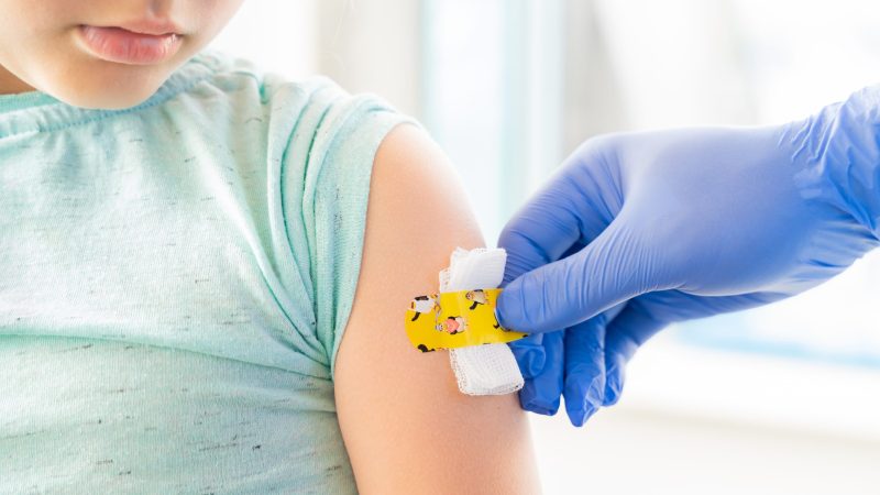 Vaccination of little girl in doctor's office
